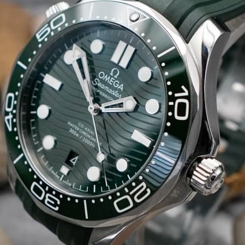 Luxury sports watch with wave-pattern dial, editorial product photograph